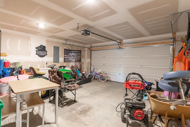 garage with electric panel and a garage door opener