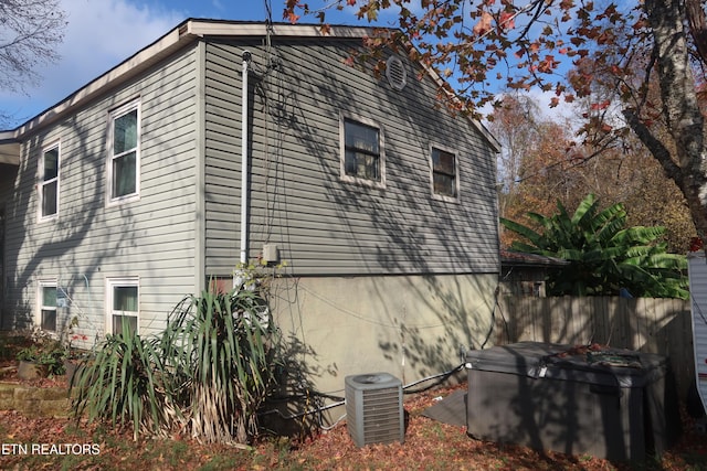 view of home's exterior with cooling unit