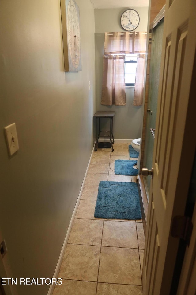 bathroom with tile patterned floors and toilet