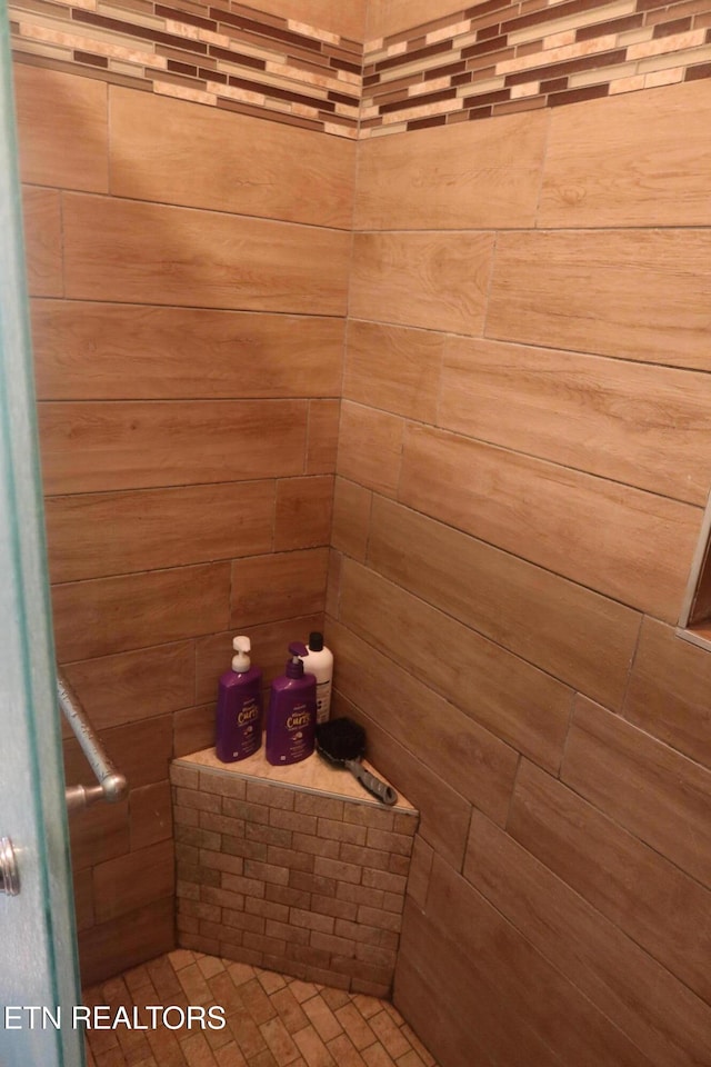 bathroom with a tile shower