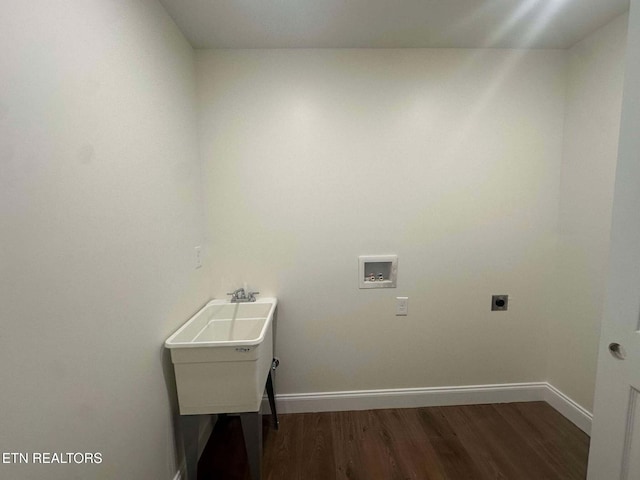 washroom with hookup for an electric dryer, dark hardwood / wood-style flooring, and washer hookup