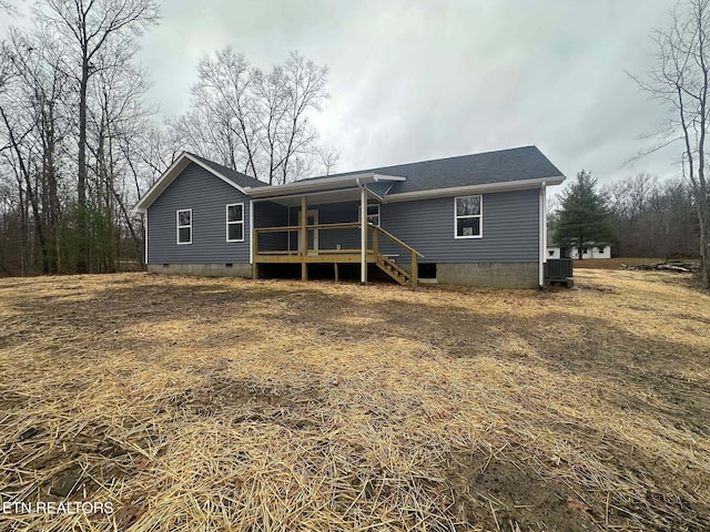 rear view of house with cooling unit