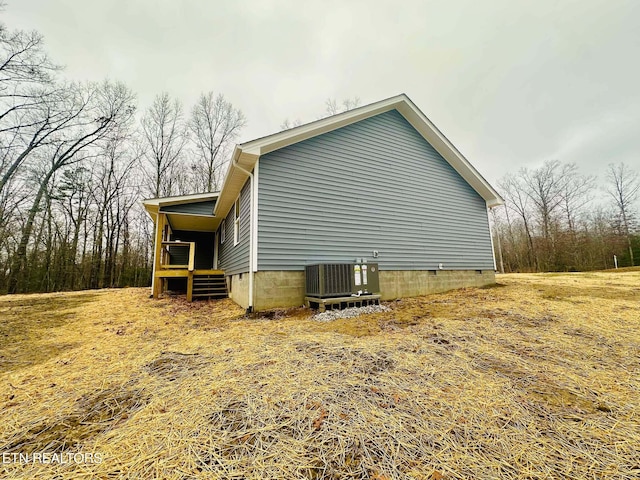 view of side of home with cooling unit