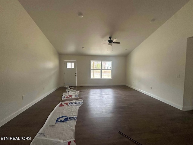 unfurnished living room featuring ceiling fan and dark hardwood / wood-style floors