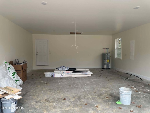 interior space featuring electric panel and water heater