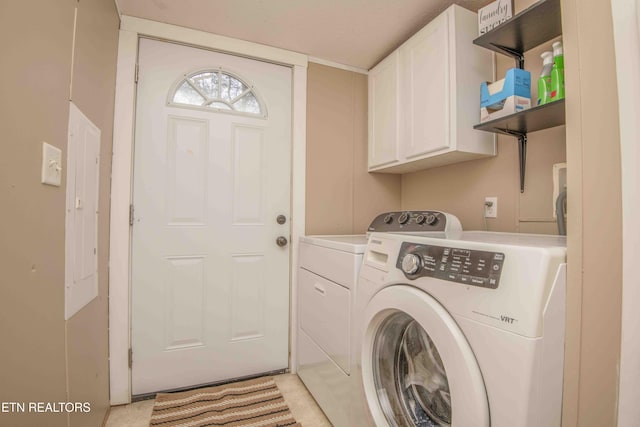 laundry area featuring cabinets and washing machine and dryer