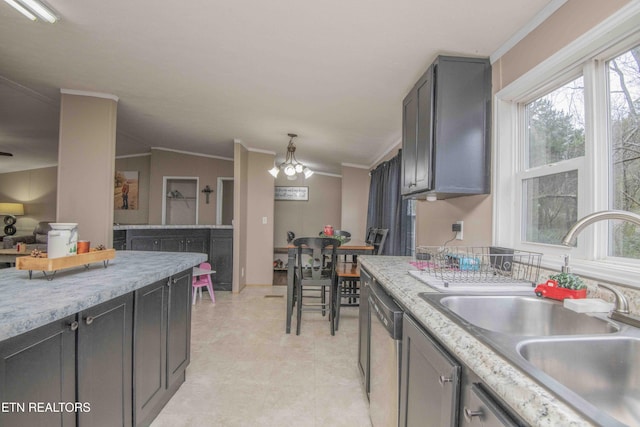 kitchen featuring vaulted ceiling, stainless steel dishwasher, crown molding, and sink