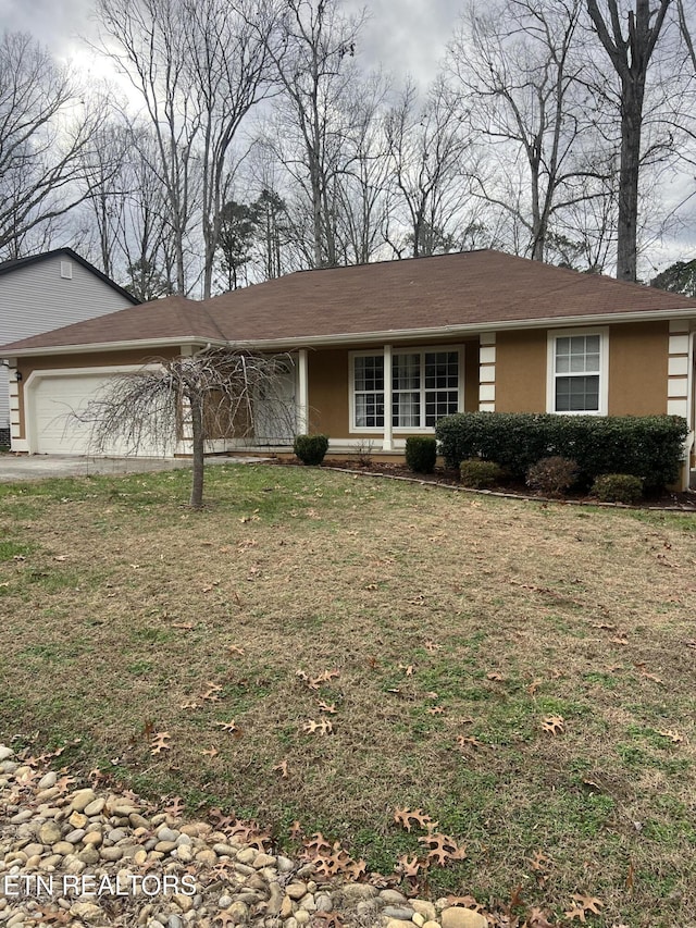 single story home featuring a front yard and a garage