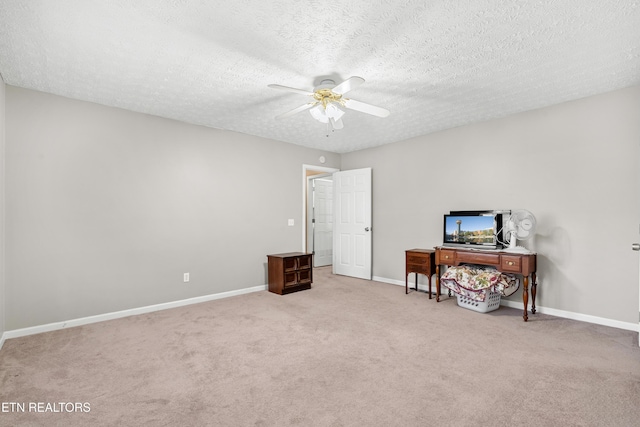 interior space with ceiling fan, a textured ceiling, and light carpet