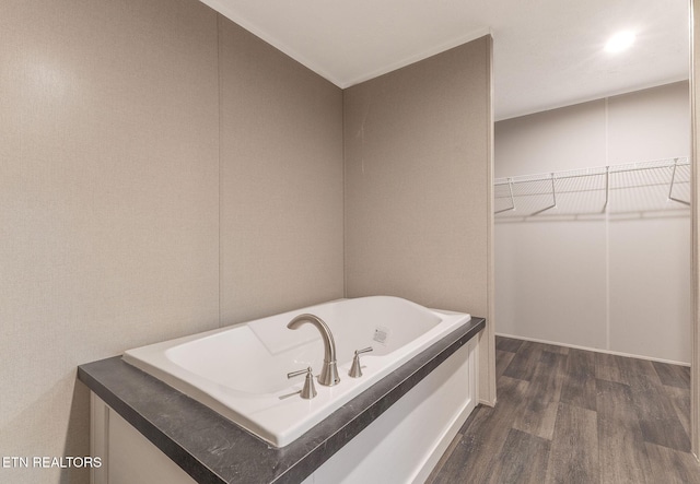 bathroom featuring a bathing tub and wood-type flooring