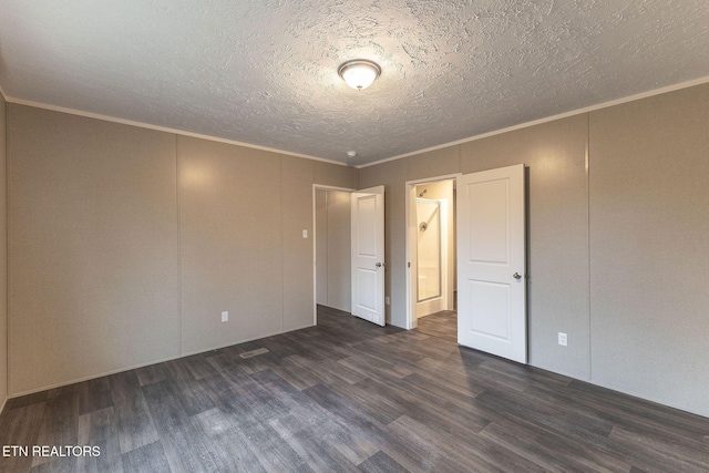 unfurnished bedroom featuring dark hardwood / wood-style floors and ornamental molding