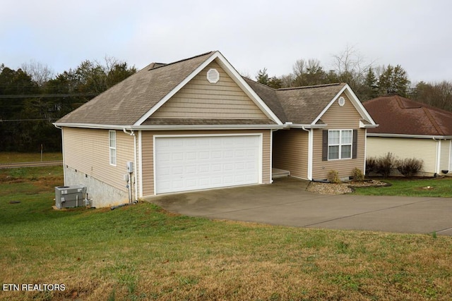 view of front of house featuring central AC unit, a garage, and a front lawn