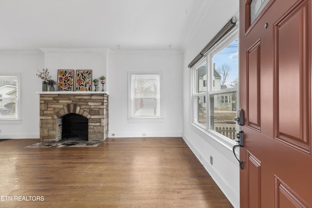 living room with a fireplace, wood-type flooring, and crown molding