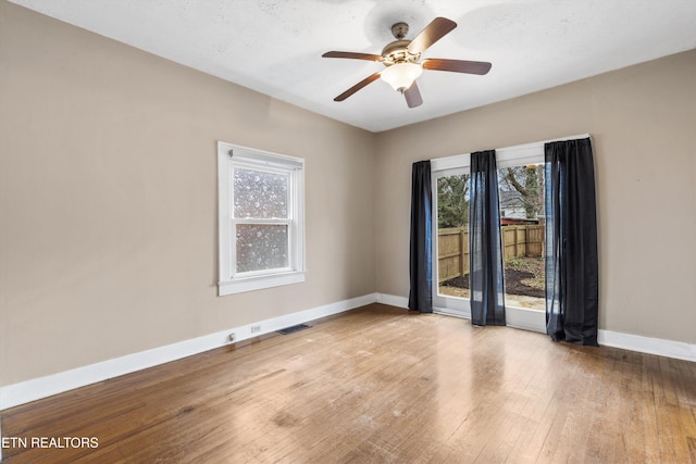 spare room with ceiling fan and light hardwood / wood-style floors