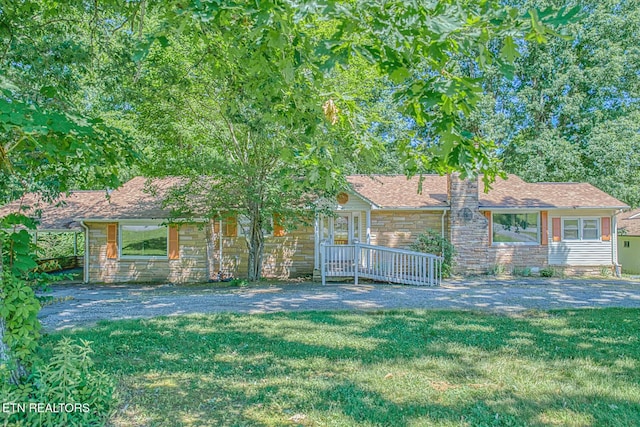 ranch-style home with a front yard