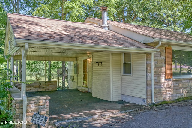 view of outbuilding with a carport