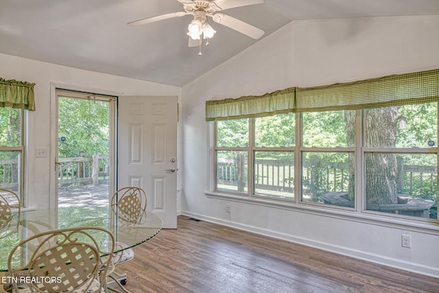 sunroom / solarium featuring ceiling fan and vaulted ceiling