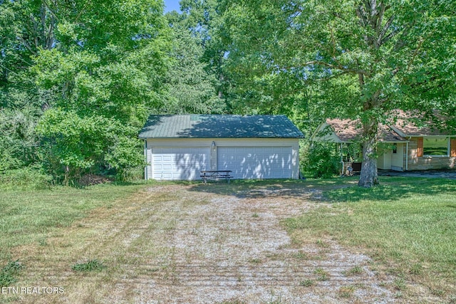 view of outbuilding with a yard