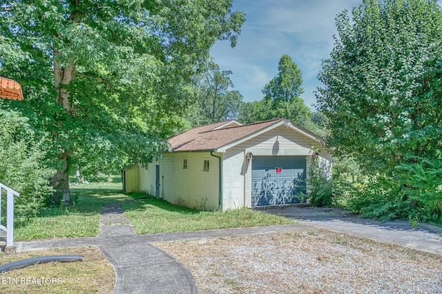 garage with a yard