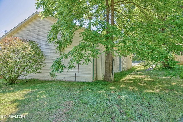 view of home's exterior featuring a yard