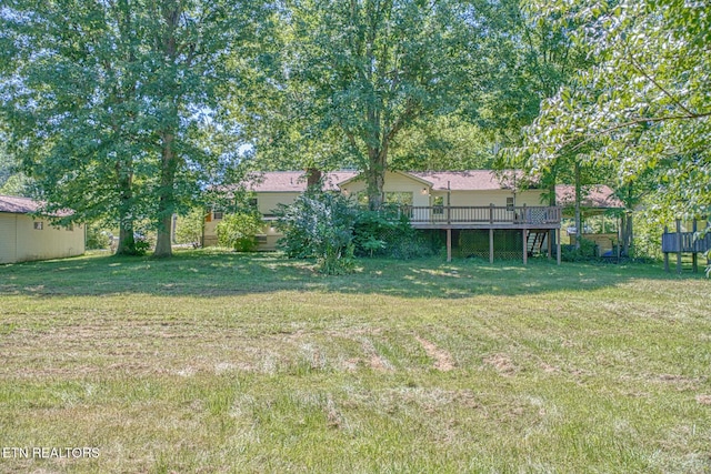 view of yard with a deck