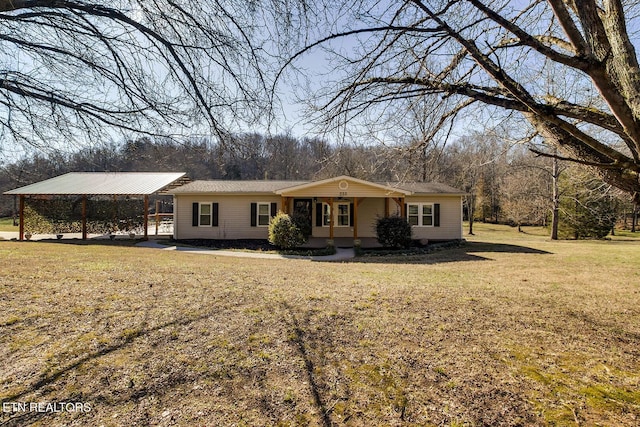 ranch-style home with a front yard, a carport, and covered porch