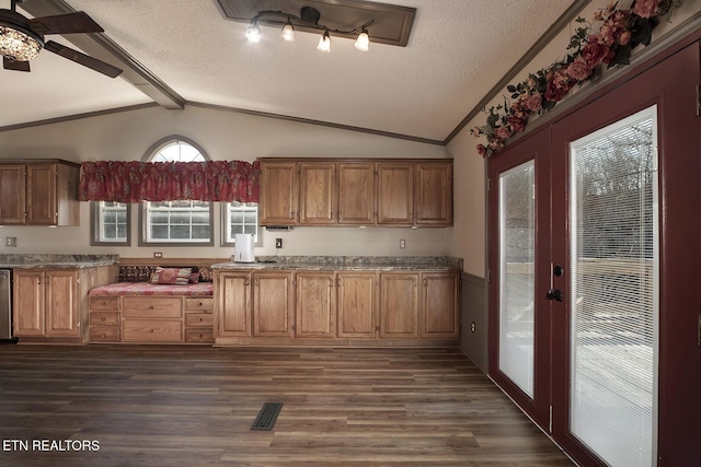 kitchen featuring french doors, lofted ceiling with beams, and dark hardwood / wood-style floors