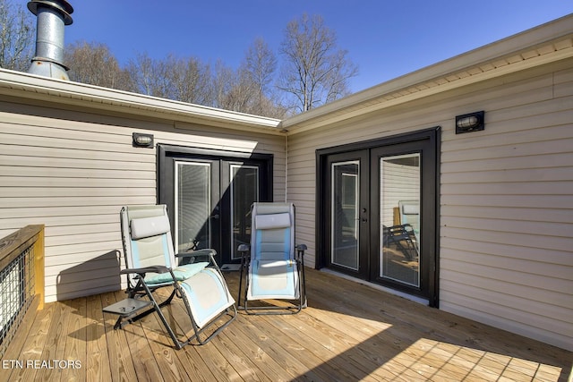 wooden deck featuring french doors