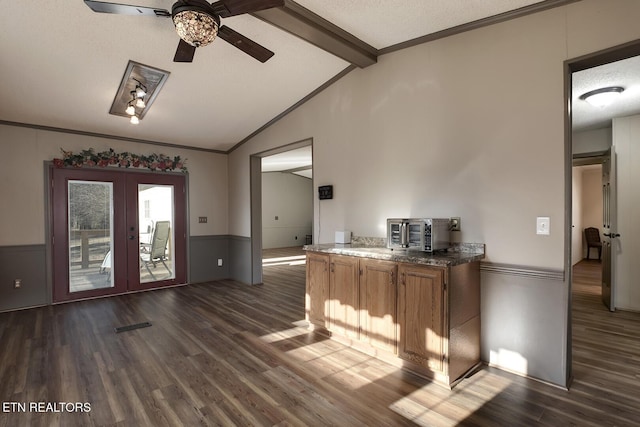 bar with french doors, lofted ceiling with beams, dark hardwood / wood-style floors, ceiling fan, and a textured ceiling