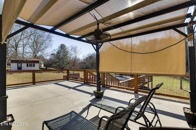 view of patio / terrace featuring ceiling fan