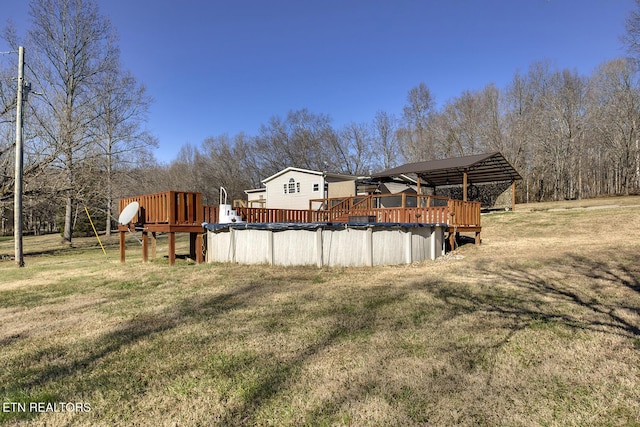 view of yard with a pool side deck