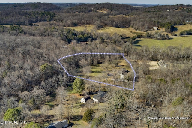 birds eye view of property featuring a rural view