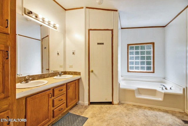 bathroom featuring vanity, crown molding, and a bath