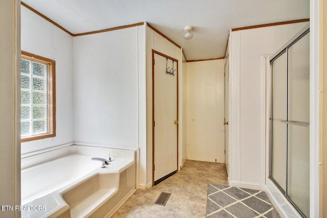 bathroom with separate shower and tub