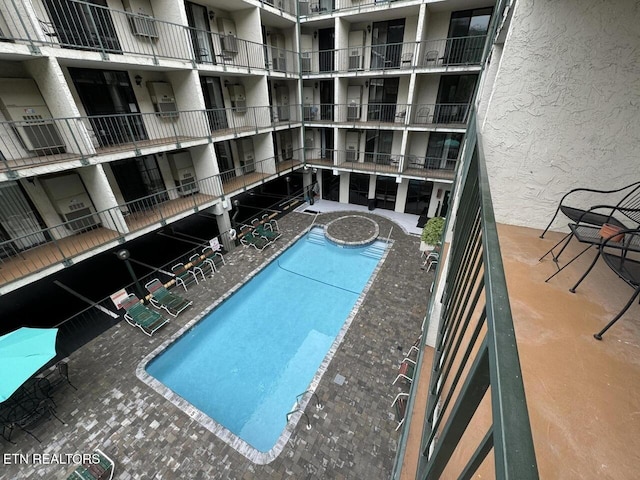 view of pool featuring a patio