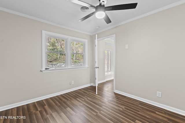 empty room with ceiling fan, dark hardwood / wood-style flooring, and crown molding