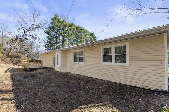 back of property featuring a deck