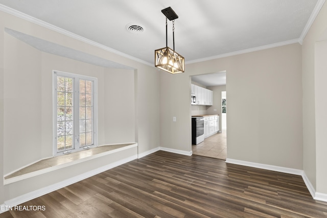 unfurnished room with a notable chandelier, dark hardwood / wood-style floors, and crown molding