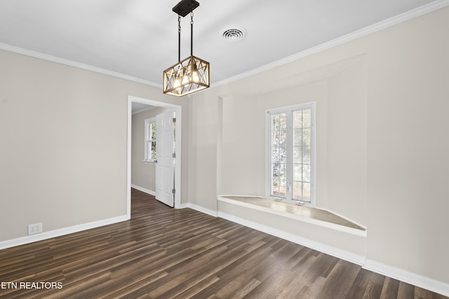 unfurnished room featuring crown molding, dark hardwood / wood-style flooring, and a notable chandelier