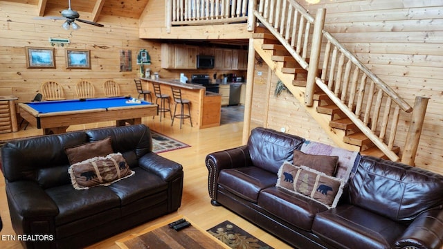 living room featuring billiards, vaulted ceiling, ceiling fan, light wood-type flooring, and wood ceiling