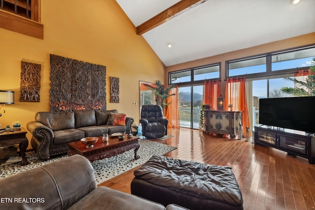 living room with beam ceiling, high vaulted ceiling, and wood-type flooring