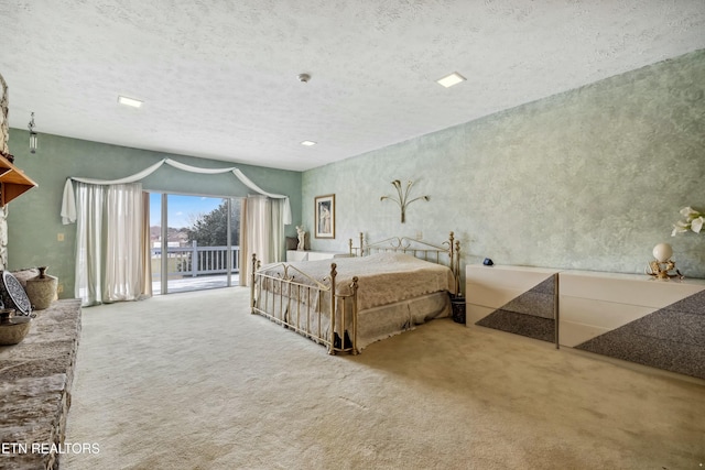 carpeted bedroom with access to exterior