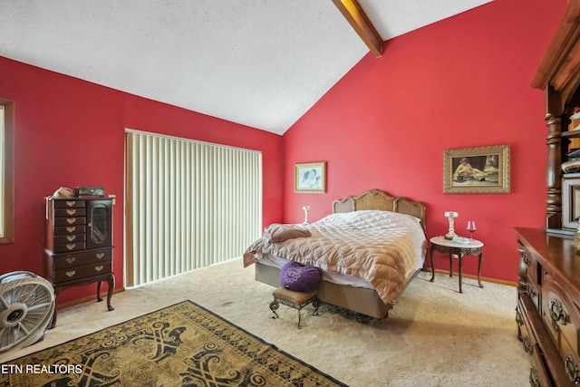 carpeted bedroom with vaulted ceiling with beams