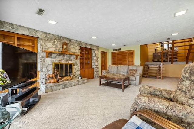 carpeted living room with a textured ceiling and a stone fireplace