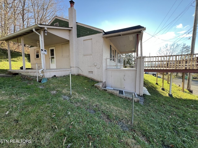 view of home's exterior with a yard