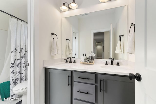 bathroom with vanity and toilet