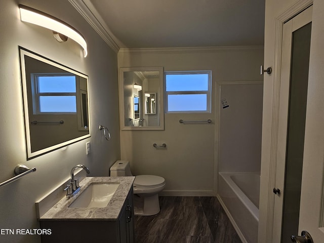 bathroom with a wealth of natural light, vanity, and ornamental molding