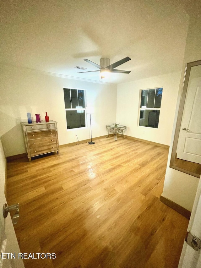 interior space featuring ceiling fan and light hardwood / wood-style flooring