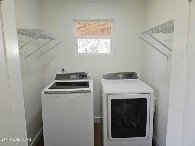 laundry room with washing machine and clothes dryer