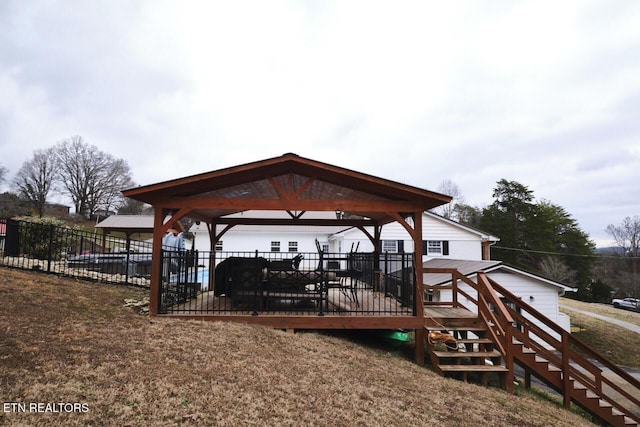 dock area featuring a gazebo and a deck